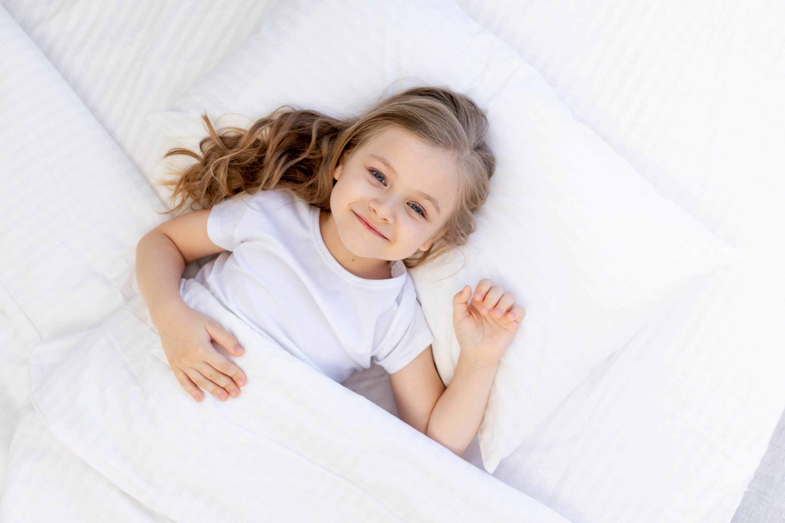 cute baby girl sleeping bed white cotton pillow blanket healthy baby sleep night 1 scaled